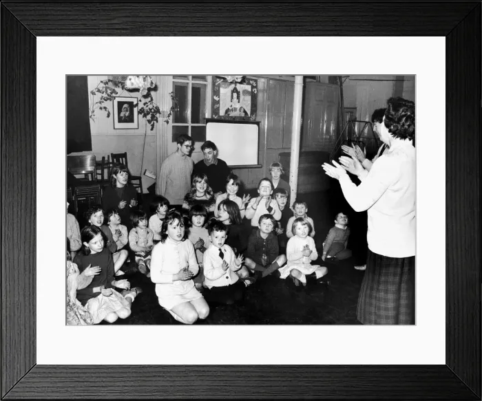 Framed Print : Children take part in a singalong lead by Mrs Ann Walker Framed Print : Children take part in a singalong lead by Mrs Ann Walker