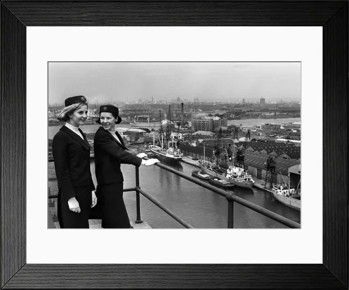 Framed Print : Port of London Dock Guides, June 1965. Two of the guides talk as they look over Framed Print : Port of London Dock Guides, June 1965. Two of the guides talk as they look over