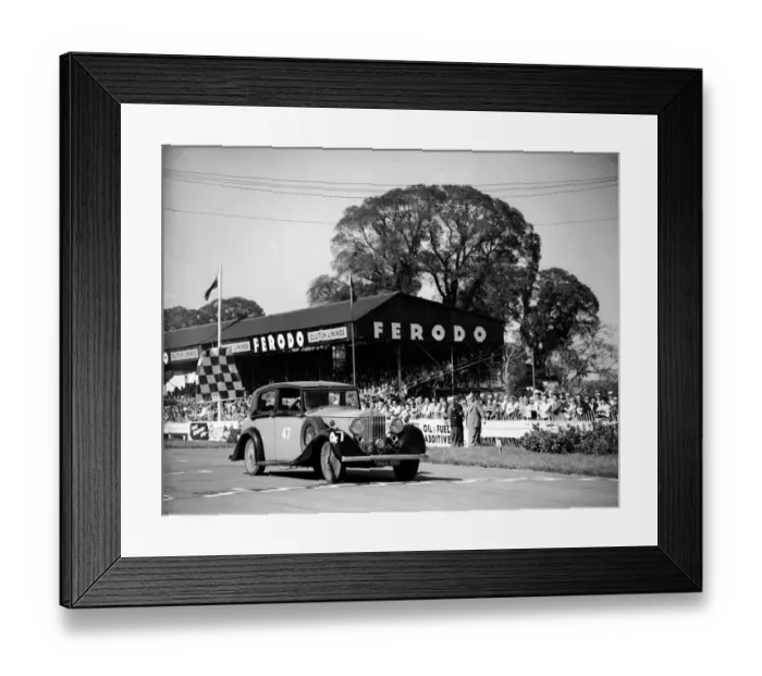Framed Print : Racing at Goodwood, Richard Murdock crossing the finishing line in the celebrities race