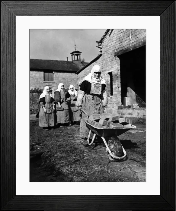 Framed Print : Nuns build a convent. Every moring 18 nuns don aprons over their habits