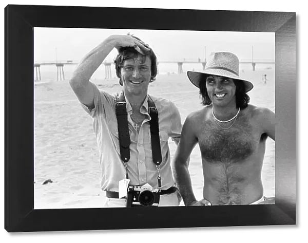 Footballer George Best poses on the beach withDaily Mirror Staff Photographer Kent Gavin