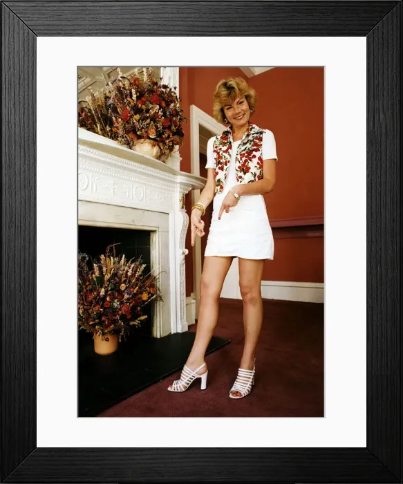 Framed Print : Actress Briony McRoberts points to white shoes she is wearing Framed Print : Actress Briony McRoberts points to white shoes she is wearing