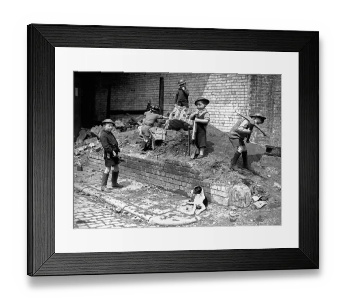 Framed Print : Children play as air raid wardens during the Blitz in London