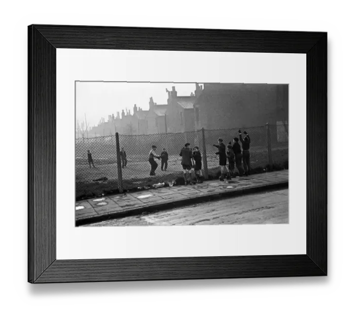 Framed Print : Life in the Mirror Our Gang. 19th January 1954 Boys playing football watched on by
