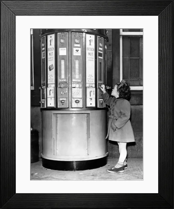 Framed Print : A young girl at a vending machine on Newcastle Central Station in 1954 Framed Print : A young girl at a vending machine on Newcastle Central Station in 1954