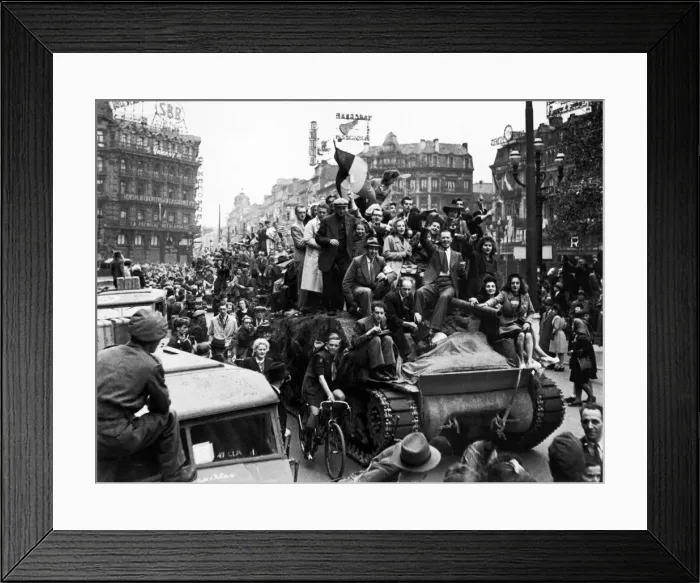 Framed Print : WW2 Belgian citizens welcome British troops to Brussels by jumping on a british tank Framed Print : WW2 Belgian citizens welcome British troops to Brussels by jumping on a british tank