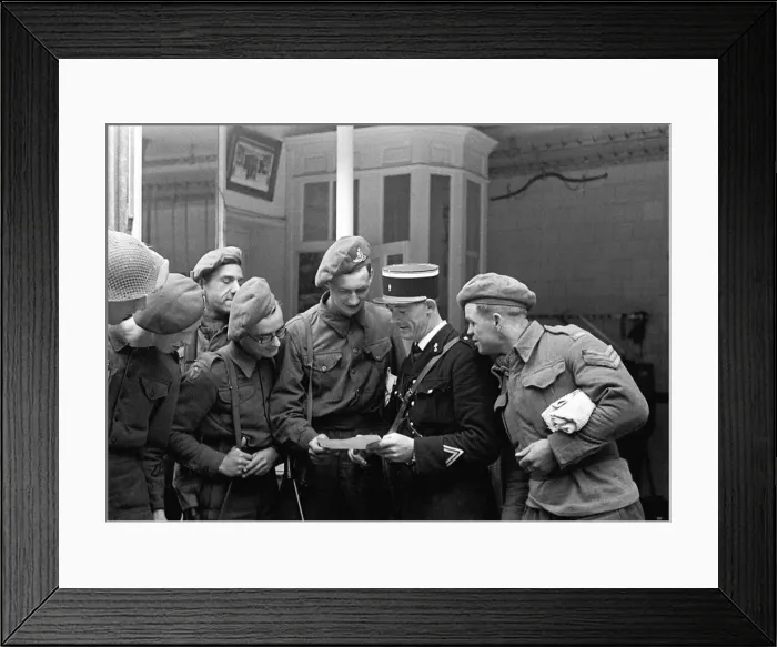 Framed Print : British troops talking to a local gendarme in a Normandy town in Northern France shortly Framed Print : British troops talking to a local gendarme in a Normandy town in Northern France shortly
