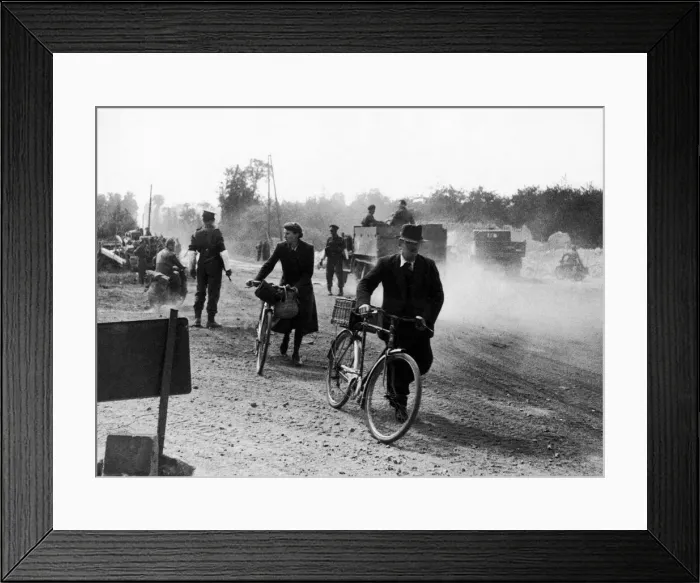 Framed Print : Road clearing in Normandy France, June 1944 French civilians pushing cycles passed