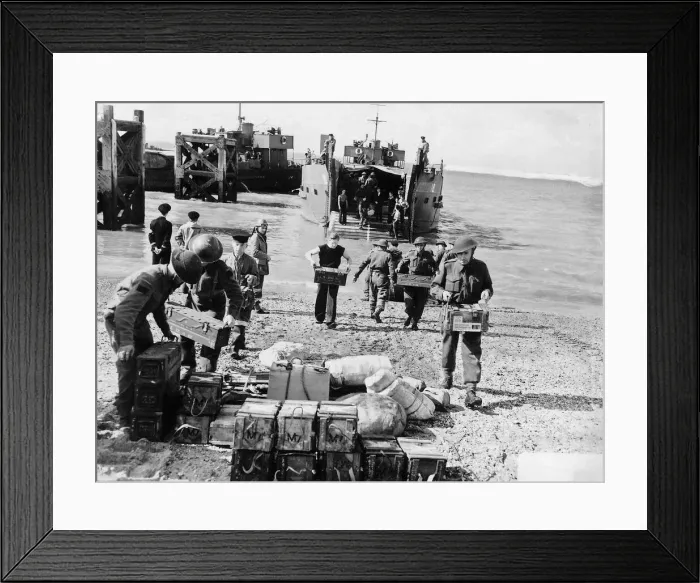 Framed Print : WW2 - Troops unload supplies from a landing craft on to British soil after a raid Framed Print : WW2 - Troops unload supplies from a landing craft on to British soil after a raid