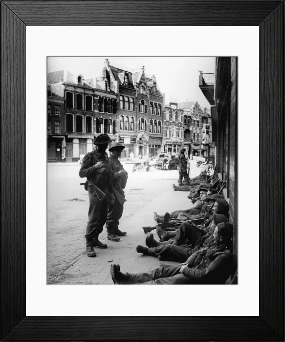 Framed Print : British Infantry soldiers take a rest in streets of Nijmegen after liberating the Dutch