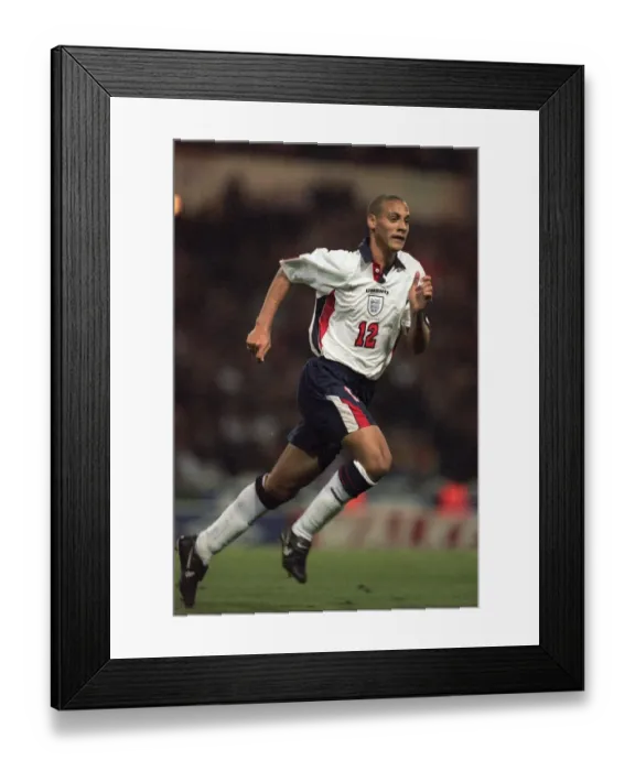 Framed Print : Football - Englands Rio Ferdinand during the game between England Framed Print : Football - Englands Rio Ferdinand during the game between England