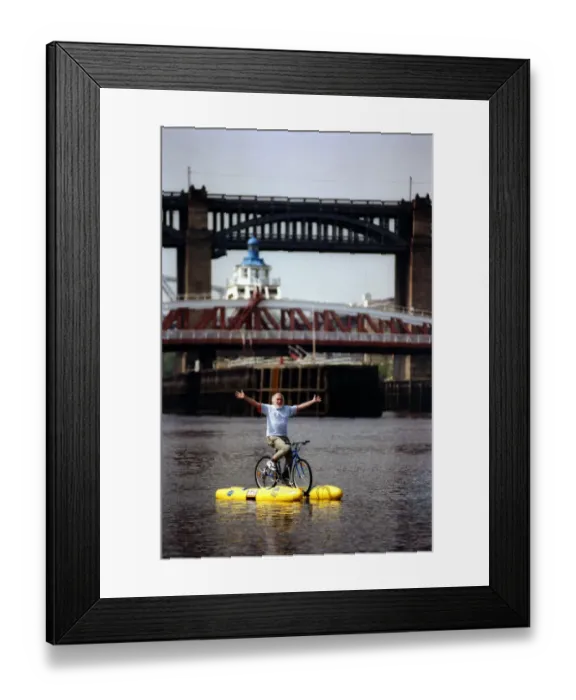 Framed Print : David Bellamy tries out the shuttle bike to cross the River Tyne in Newcastle on 11th May