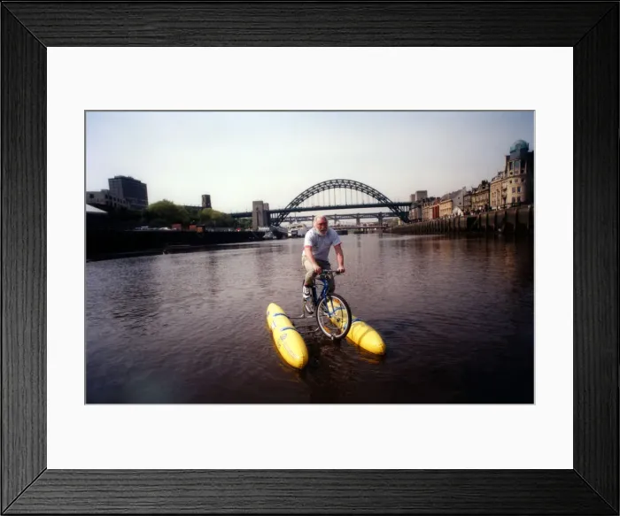 Framed Print : David Bellamy tries out the shuttle bike to cross the River Tyne in Newcastle on 11th May