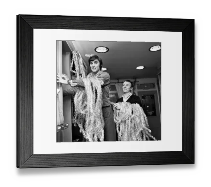 Framed Print : Manchester United footballer George Best decorating his Edwardian boutique 7th