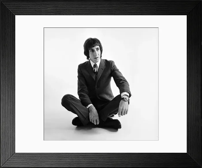 Framed Print : Pete Townshend of British rock group The Who, poses in the studio wearing suit and tie Framed Print : Pete Townshend of British rock group The Who, poses in the studio wearing suit and tie