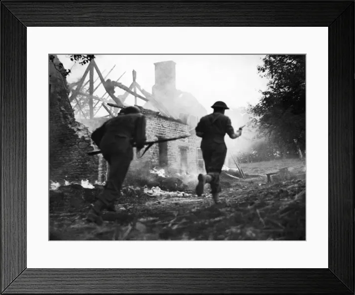 Framed Print : The advance south of Le Beny Bocage continues. British infantry are seen here rushing Framed Print : The advance south of Le Beny Bocage continues. British infantry are seen here rushing