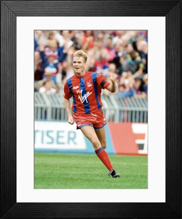 Framed Print : Crystal Palace footballer Geoff Thomas celebrates after scoring a goal in the league