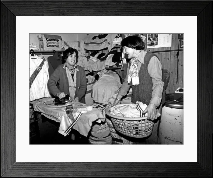 Framed Print : Crystal Palace laundry ladies prepare the shirts before a game against Manchester United
