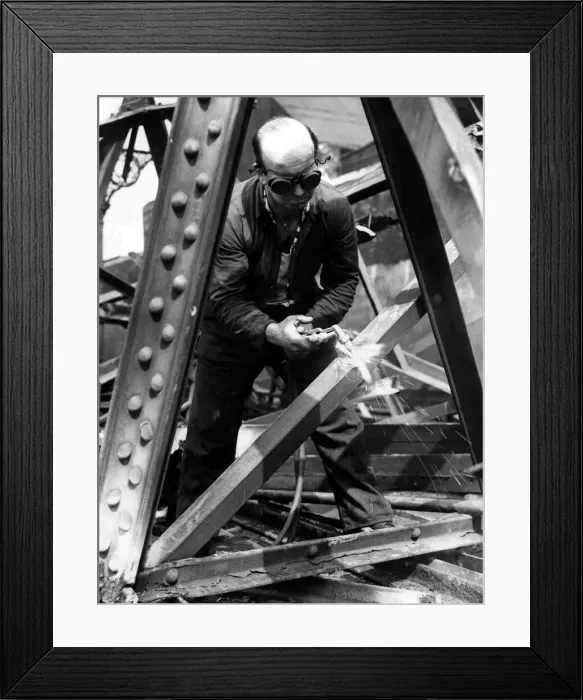 Framed Print : Demolition man Jack Spence gust through a steel girdon on 7th June 1962