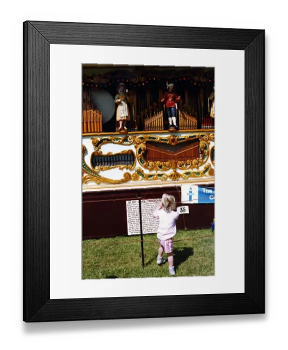 Framed Print : A little girl watching a fairground orgon at the Vintage Car Framed Print : A little girl watching a fairground orgon at the Vintage Car