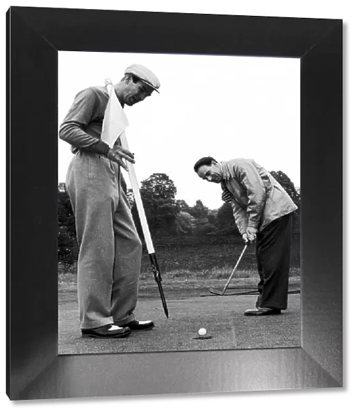 Birmingham Mail film critic Arthur Steele plays golf with Stanley Baker in Richmond