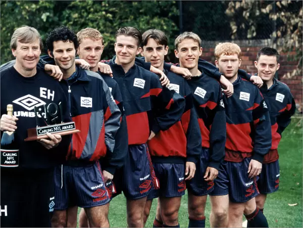 Manchester United youth team coach Eric Harrison is awarded a bottle of champagne