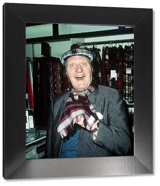 Comedian Tommy Cooper in a tartan shop 1974