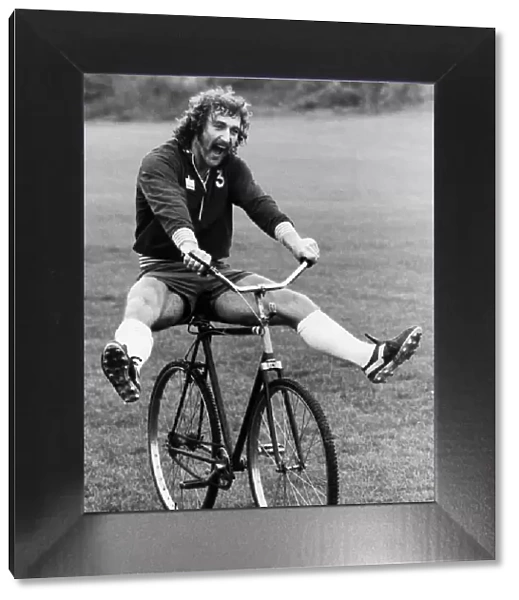 Jim Cannon of Crystal Palace riding a bicycle during a training session