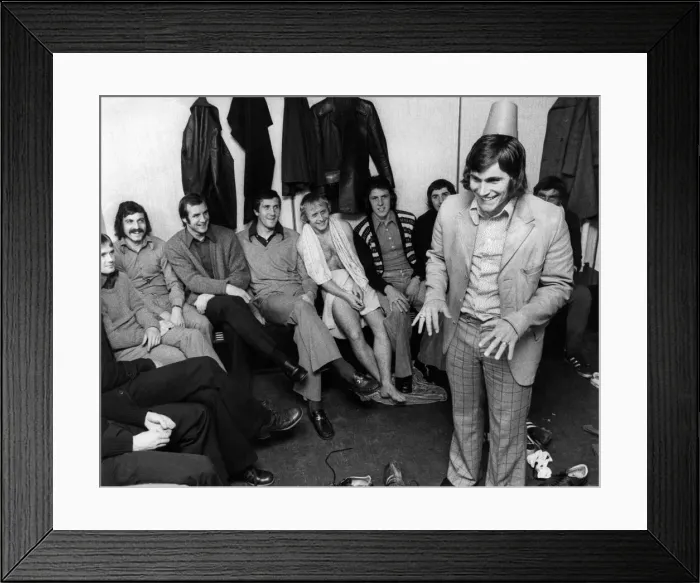Framed Print : Crystal Palace footballer Peter Taylor entertains the rest of the squad with his Tommy