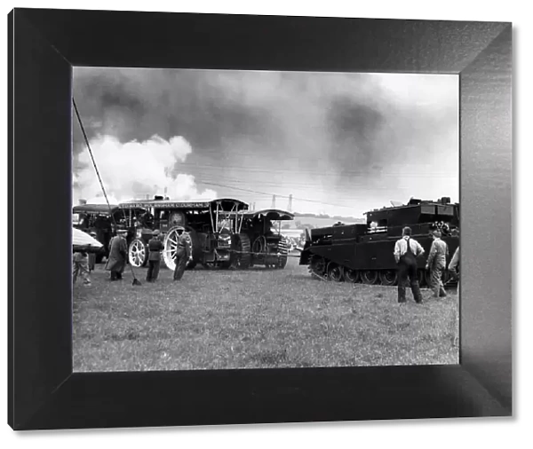 Traction engines and a tank having a tug of war at a Steam Rally on 10th June 1961
