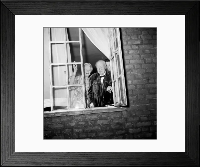 Framed Print : Sir Winston Churchill and Lady Churchill look from the window of his London home in Hyde Framed Print : Sir Winston Churchill and Lady Churchill look from the window of his London home in Hyde
