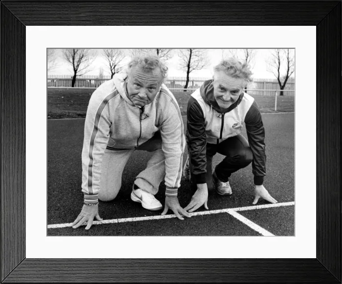 Framed Print : Former Goon Sir Harry Secombe is given a few tips from Steve Cram
