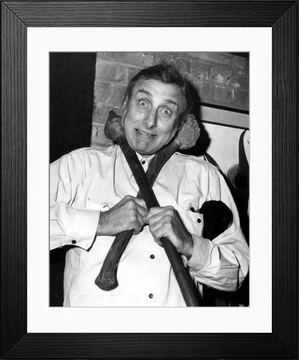 Framed Print : Former Goon Spike Milligan is pictured with two aboriginal weapons Framed Print : Former Goon Spike Milligan is pictured with two aboriginal weapons