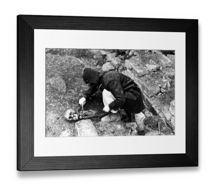 Framed Print : Two skeletons have been unearthed by archaeologists who have been working for several