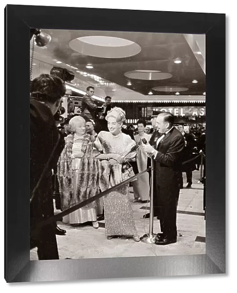 Joan Crawford at the Premier of My Fair Lady film in New York laughing