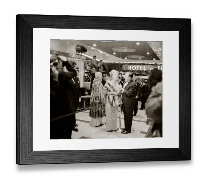 Framed Print : Joan Crawford at the Premier of My Fair Lady film in New York speaking to reporter