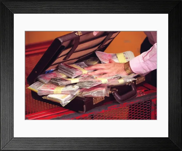 Framed Print : Harry Harris with a briefcase full of money Framed Print : Harry Harris with a briefcase full of money
