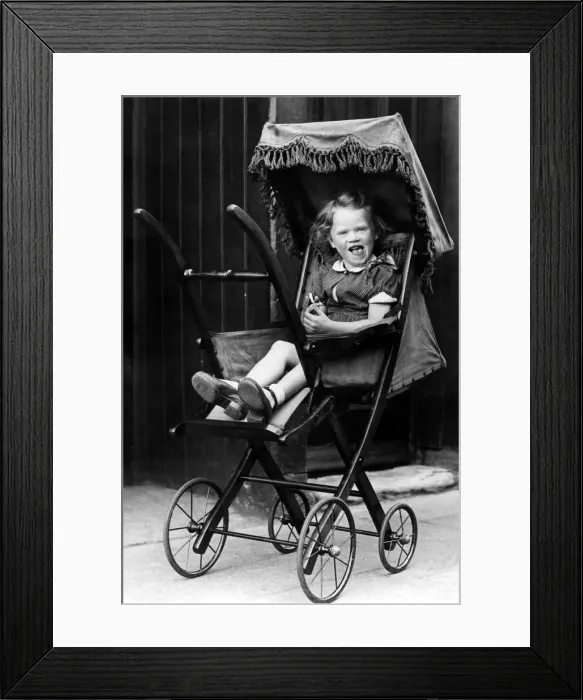 Framed Print : The old pram which is illustrated here is believed to be 100 years old Framed Print : The old pram which is illustrated here is believed to be 100 years old