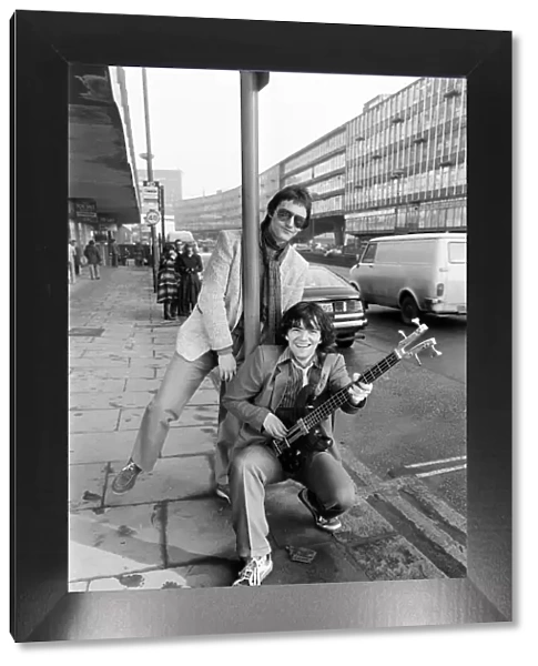 Guitarist Gerry Cott (standing) and bass player Peter Briquette from the Boomtown Rats