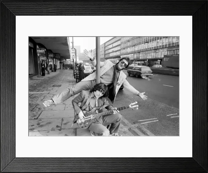 Framed Print : Guitarist Gerry Cott (standing) and bass player Peter Briquette from the Boomtown Rats