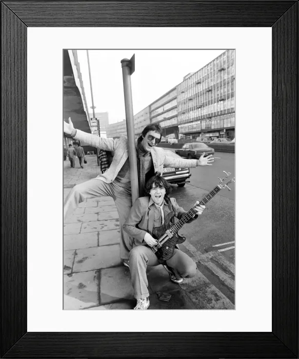 Framed Print : Guitarist Gerry Cott (standing) and bass player Peter Briquette from the Boomtown Rats Framed Print : Guitarist Gerry Cott (standing) and bass player Peter Briquette from the Boomtown Rats