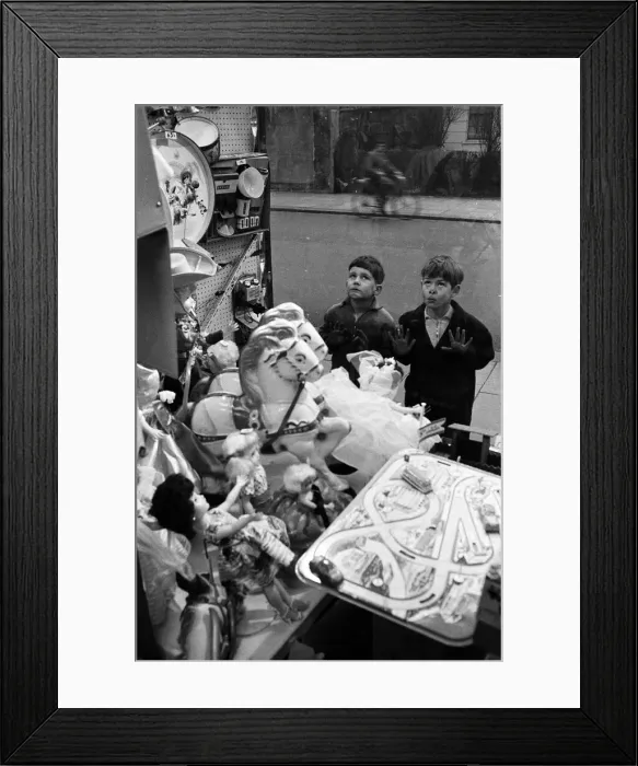 Framed Print : Children look longingly at toys into shop window at Christmas, 16th December 1960 Framed Print : Children look longingly at toys into shop window at Christmas, 16th December 1960