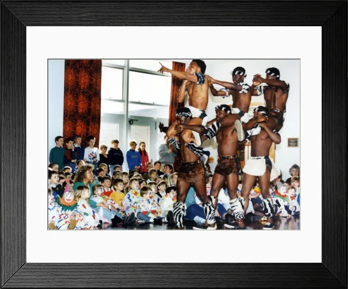Framed Print : Circus visits Redcar, children dressed as clowns watching performers from a circus