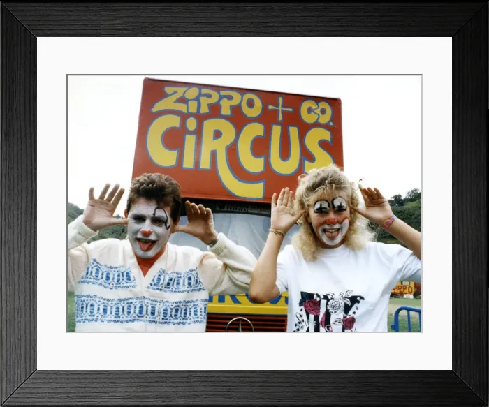 Framed Print : Two people with their faces painted like clowns, pulling funny faces, at the Zippo & Co Framed Print : Two people with their faces painted like clowns, pulling funny faces, at the Zippo & Co