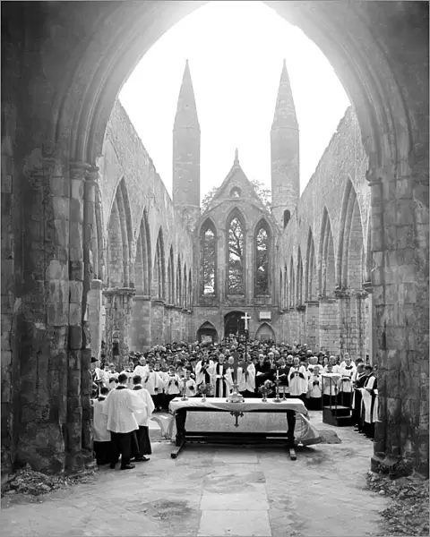 A church service in the bombed out remains of Norwich Cathedral