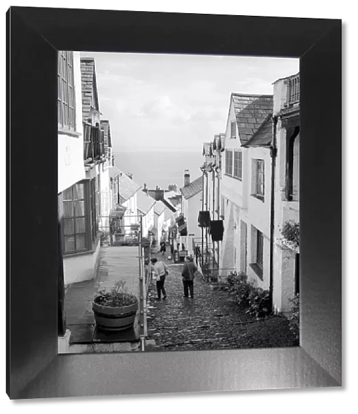 Tourists making their way down the steep hill in the village of Clovelly in North Devon