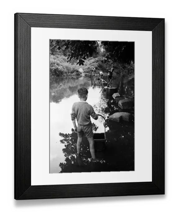 Framed Print : Young boys playing on some stepping stones on a river in Surrey. Circa 1945 Framed Print : Young boys playing on some stepping stones on a river in Surrey. Circa 1945