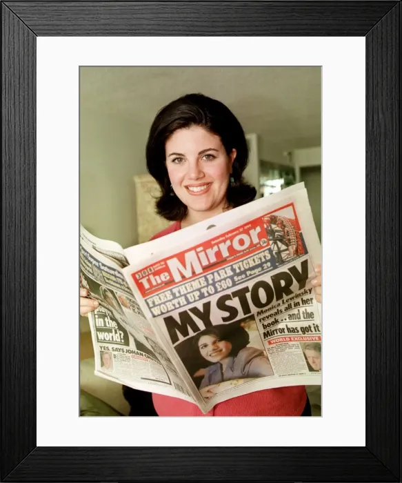 Framed Print : Monica Lewinsky at home July 1999 reading Daily Mirror