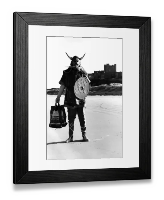 Framed Print : Colin the Viking on Bamburgh beach on 20th February 1990 a sight for the tourists