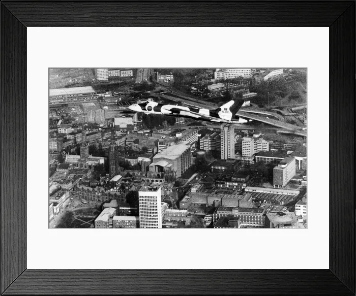 Framed Print : Vulcan Delta bomber NQJ swoops spectacularly over the city of Coventry as a thank you to